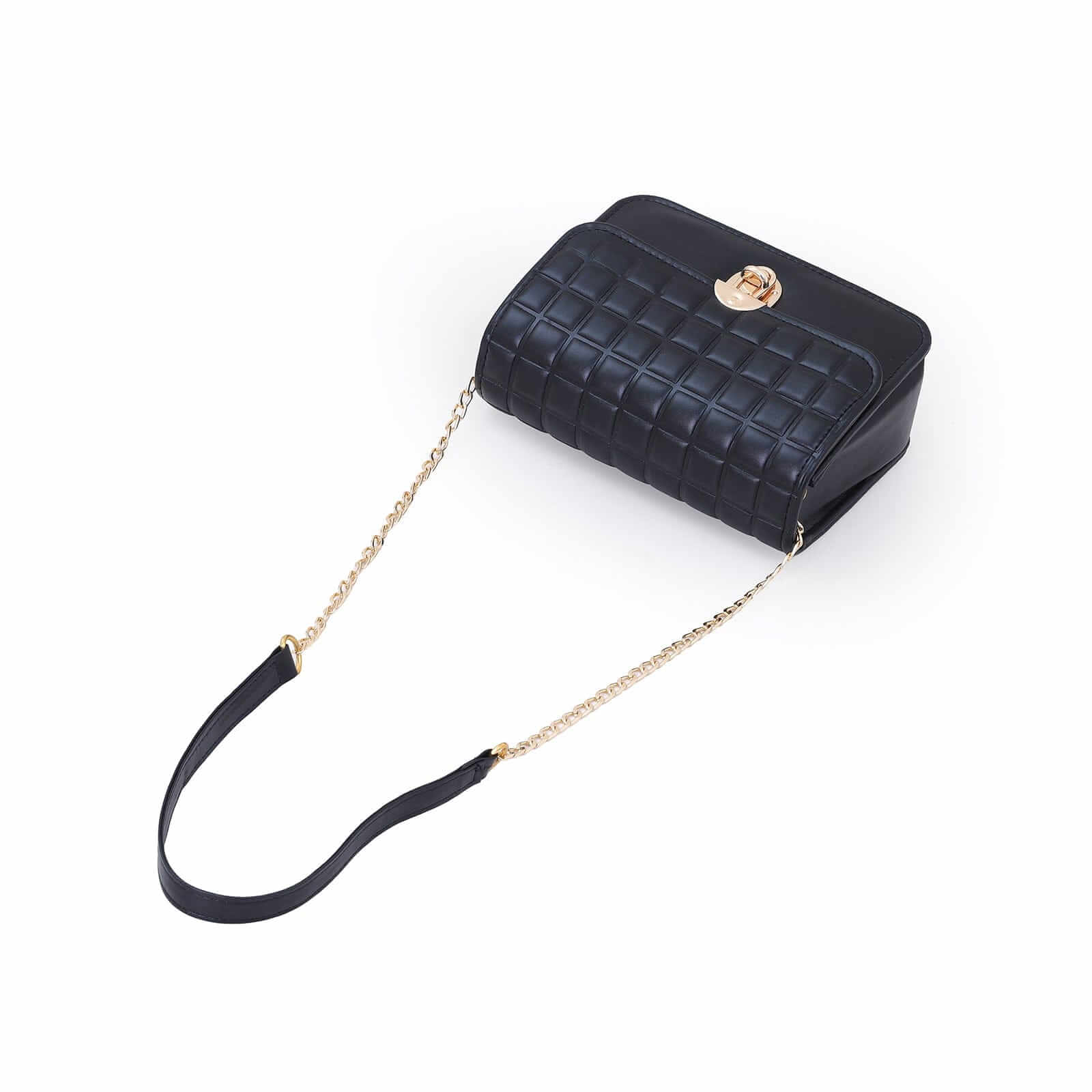 Boxer Box handbag worn on shoulder with chain strap in a modern setting.